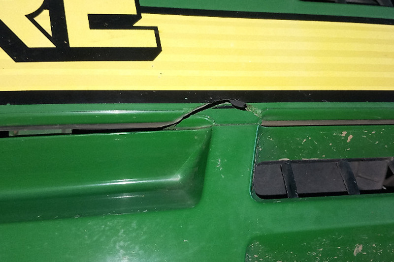 Photo gallery, repairing a cracked hood on a tractor